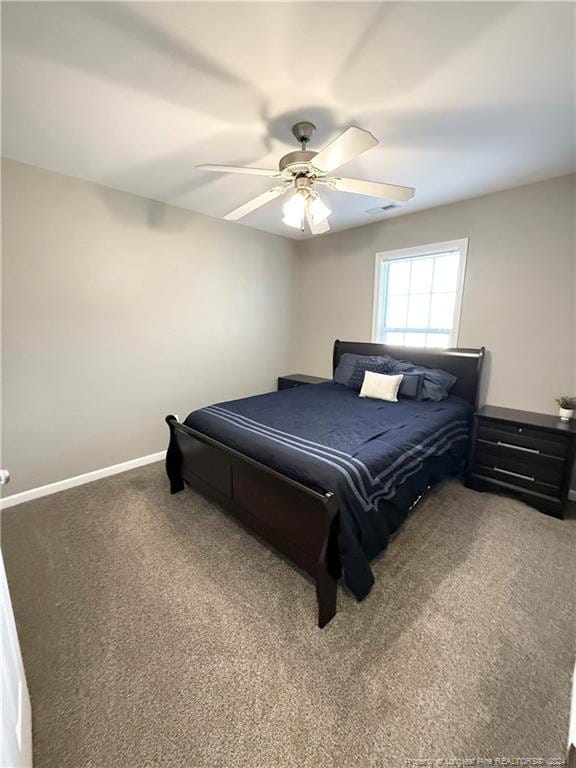 bedroom with ceiling fan and carpet floors