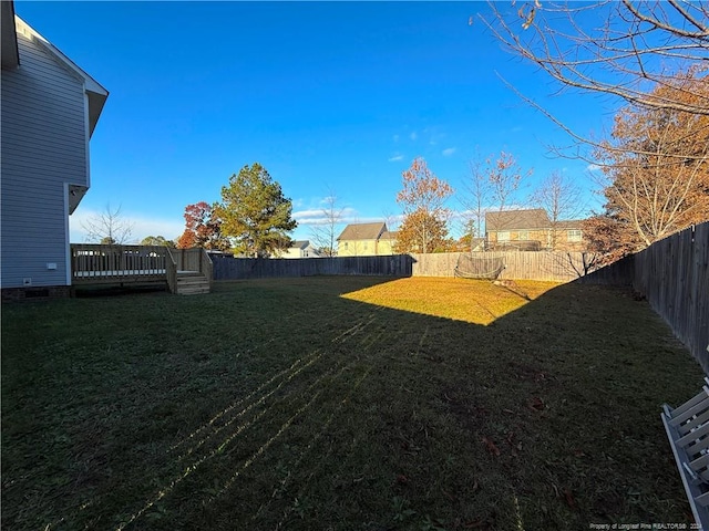 view of yard featuring a wooden deck