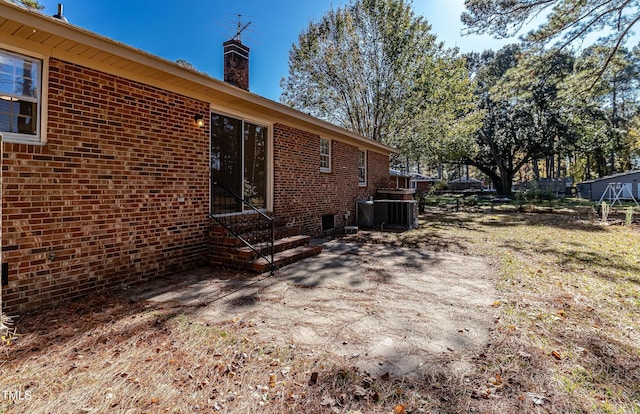 view of home's exterior with central AC