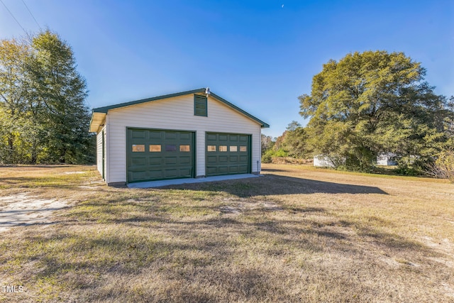 garage with a yard