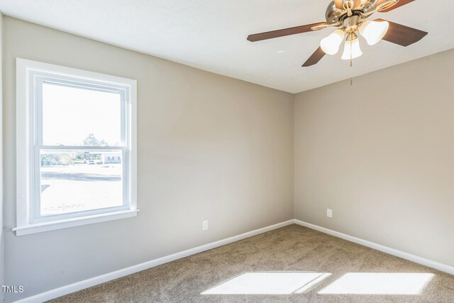 carpeted empty room with ceiling fan