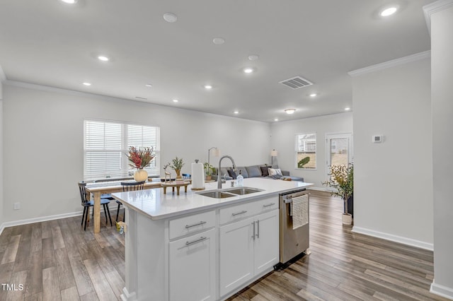 kitchen featuring white cabinetry, sink, dishwasher, a center island with sink, and light wood-type flooring