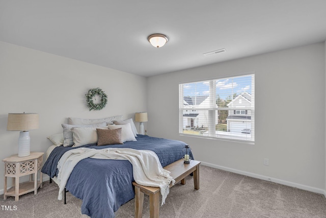 bedroom featuring light colored carpet