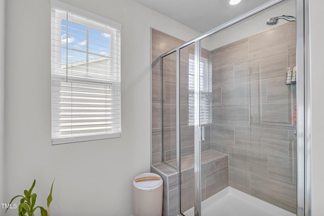 bathroom featuring a healthy amount of sunlight and an enclosed shower