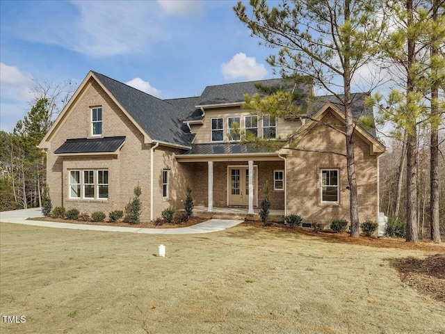 craftsman-style house featuring a porch and a front yard