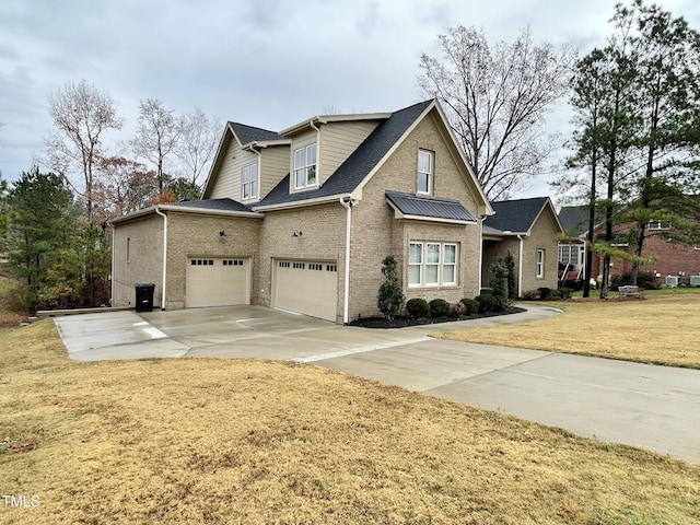 view of front of property with a front yard and a garage