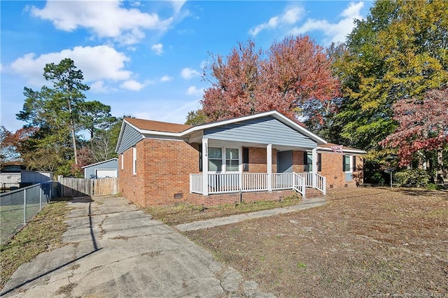 bungalow-style home with an outdoor structure and a porch