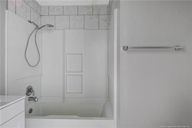 bathroom featuring vanity and tub / shower combination