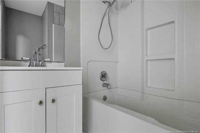 bathroom with vanity and tub / shower combination