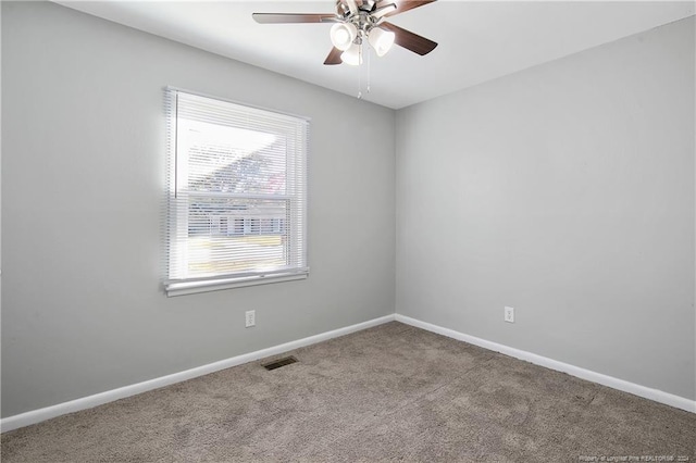 spare room with carpet floors and ceiling fan