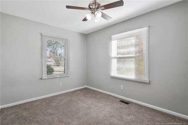 carpeted empty room with ceiling fan