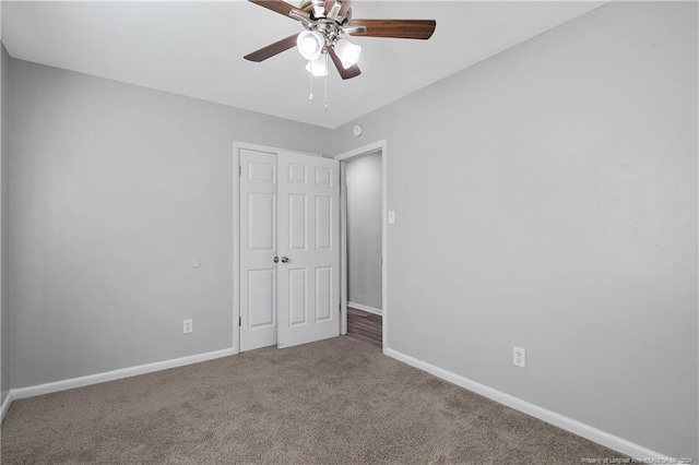 unfurnished bedroom featuring carpet flooring and ceiling fan