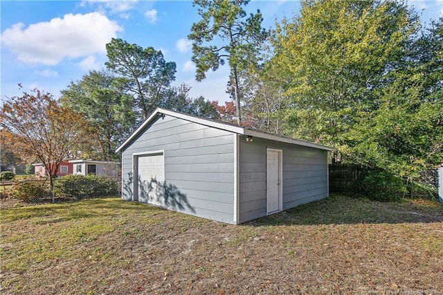 view of outbuilding with a lawn