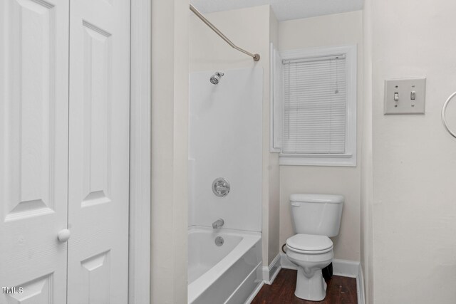 1204 Breedlove Rd, Nashville, NC 27856 - bathroom with toilet, baseboards, shower / bath combination, and wood finished floors