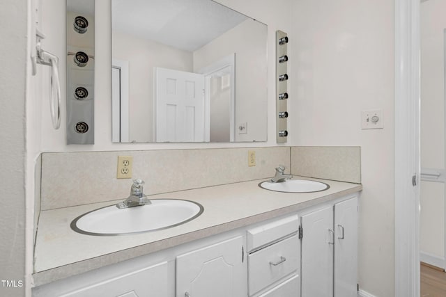 1204 Breedlove Rd, Nashville, NC 27856 - bathroom featuring double vanity and tasteful backsplash