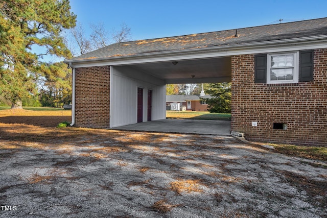 1204 Breedlove Rd, Nashville, NC 27856 - garage featuring an attached carport and driveway