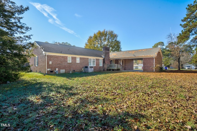1204 Breedlove Rd, Nashville, NC 27856 - rear view of property with a yard, brick siding, and a chimney