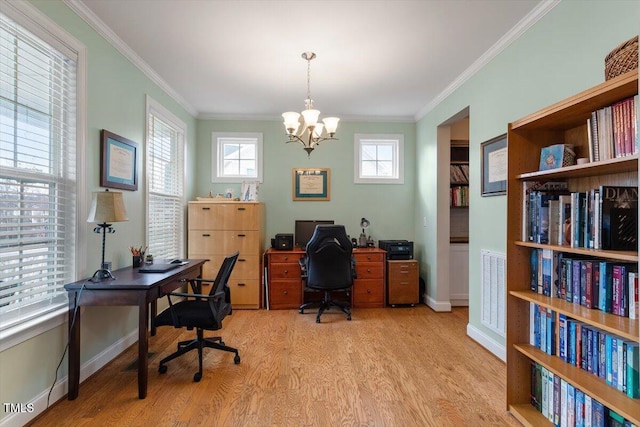 office space with crown molding, an inviting chandelier, light hardwood / wood-style flooring, and a wealth of natural light