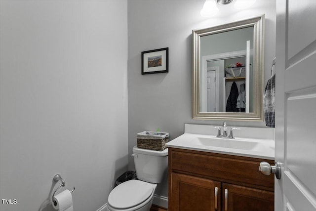 bathroom with toilet and vanity