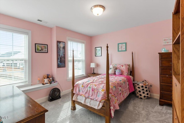 bedroom featuring light carpet