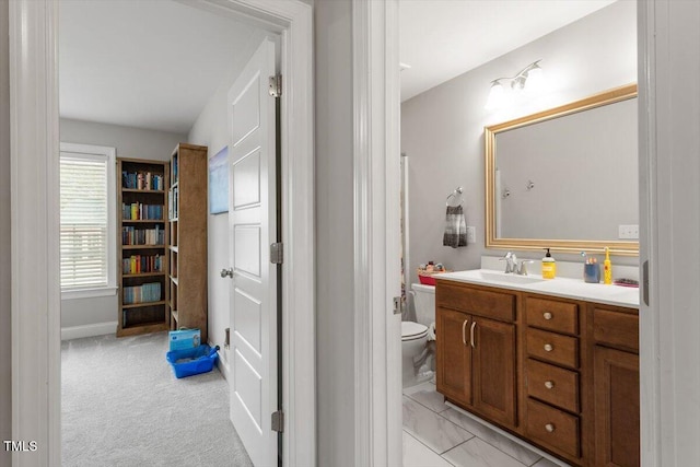 bathroom featuring vanity and toilet