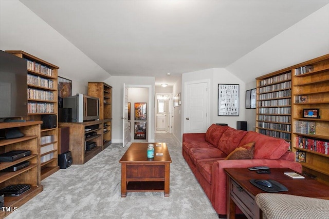 living room featuring light carpet and lofted ceiling