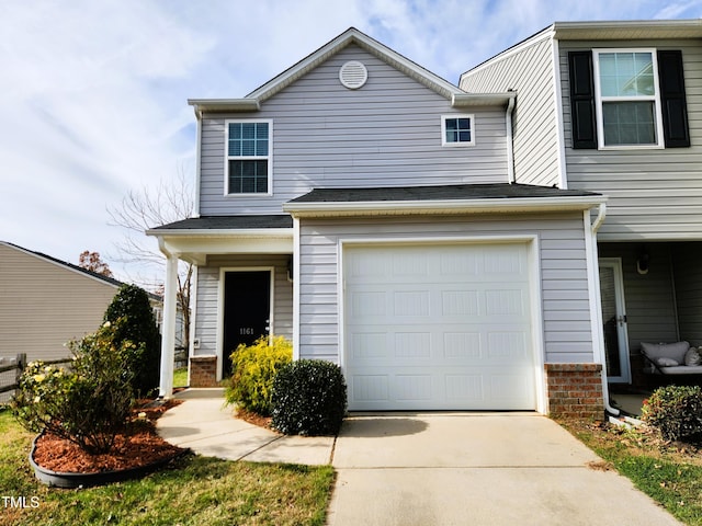 view of front of property with a garage