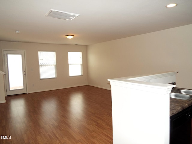 unfurnished room with dark hardwood / wood-style flooring