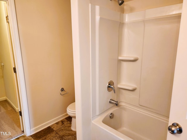 bathroom featuring toilet and bathing tub / shower combination