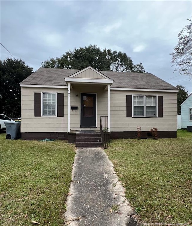 bungalow with a front lawn