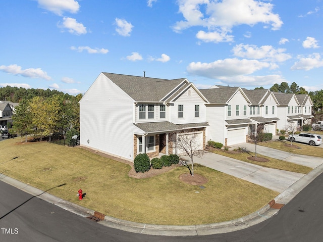 view of front of property with a front yard and a garage