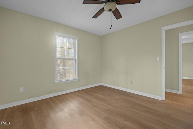 unfurnished room featuring ceiling fan and light hardwood / wood-style flooring