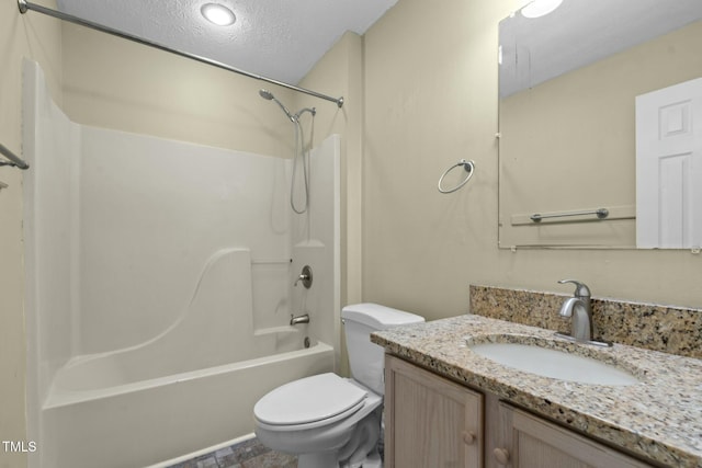 full bathroom featuring vanity, a textured ceiling, shower / bath combination, and toilet