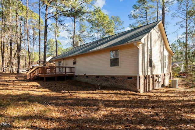 view of side of home with cooling unit and a wooden deck