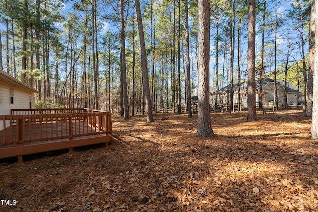 view of yard featuring a wooden deck