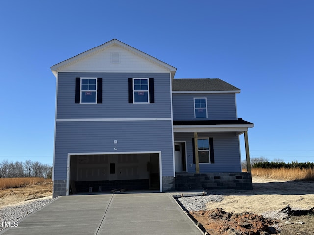 view of front of home with a garage and covered porch