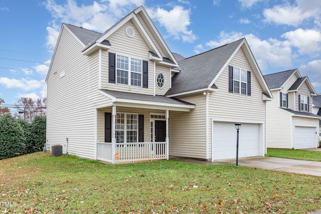 view of front of property with a front yard, a porch, central AC, and a garage