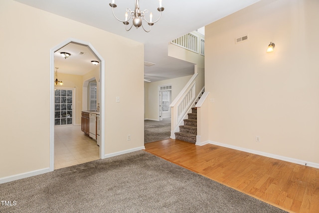 interior space featuring light hardwood / wood-style floors and a chandelier