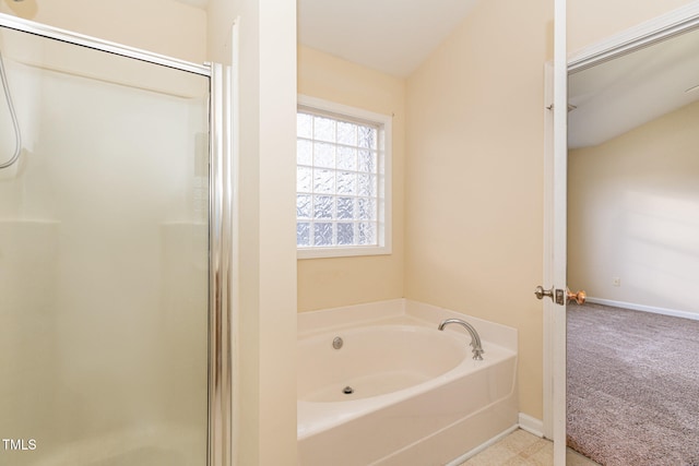 bathroom featuring independent shower and bath