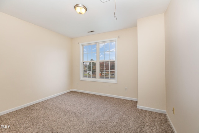 unfurnished room featuring carpet