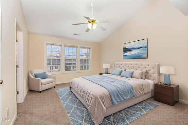 carpeted bedroom with ceiling fan and vaulted ceiling