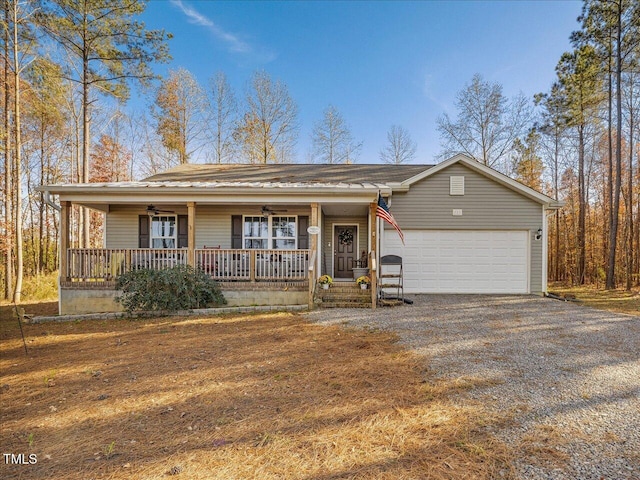 ranch-style home featuring covered porch and a garage