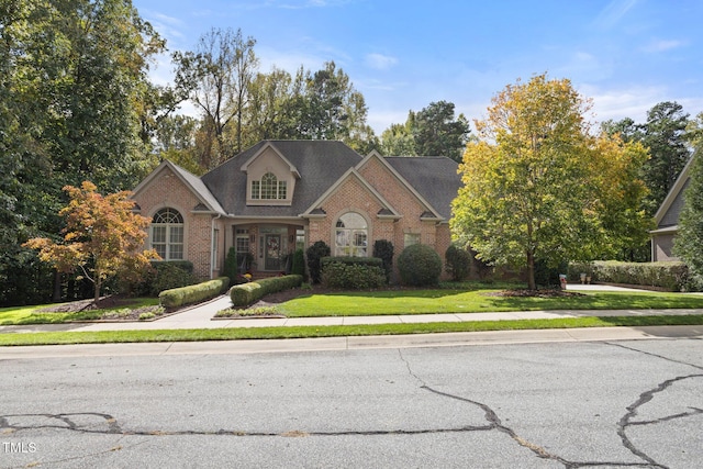 view of front of property with a front lawn