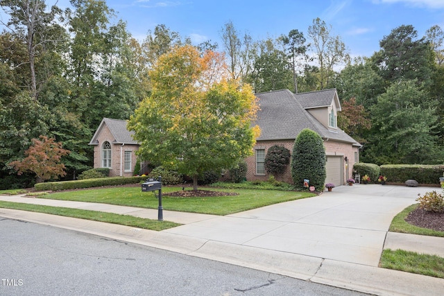 view of front facade featuring a garage and a front lawn