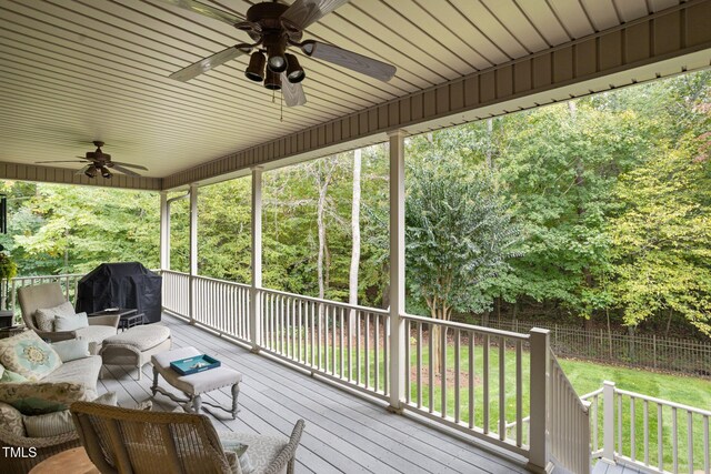 wooden deck with an outdoor living space, area for grilling, and ceiling fan