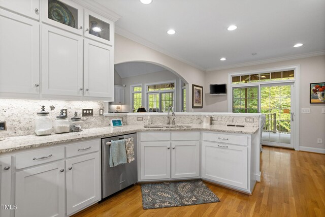 kitchen featuring dishwasher, light hardwood / wood-style floors, plenty of natural light, and sink