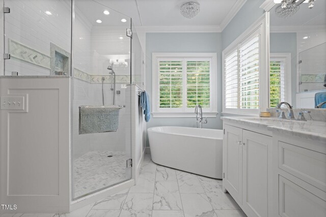 bathroom with vanity, shower with separate bathtub, and ornamental molding