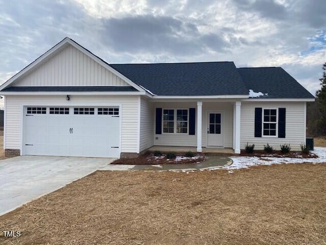 view of front of house with a garage and covered porch