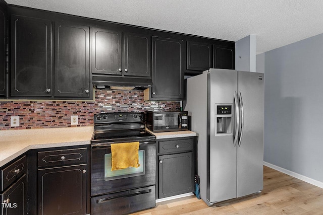 kitchen with stainless steel fridge, decorative backsplash, black electric range oven, and light wood-type flooring