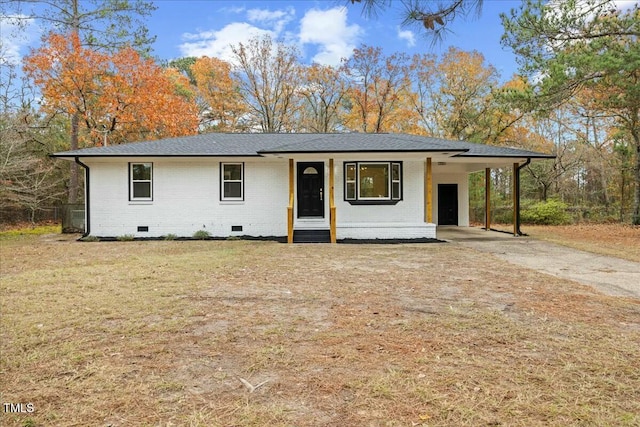 ranch-style home featuring a carport